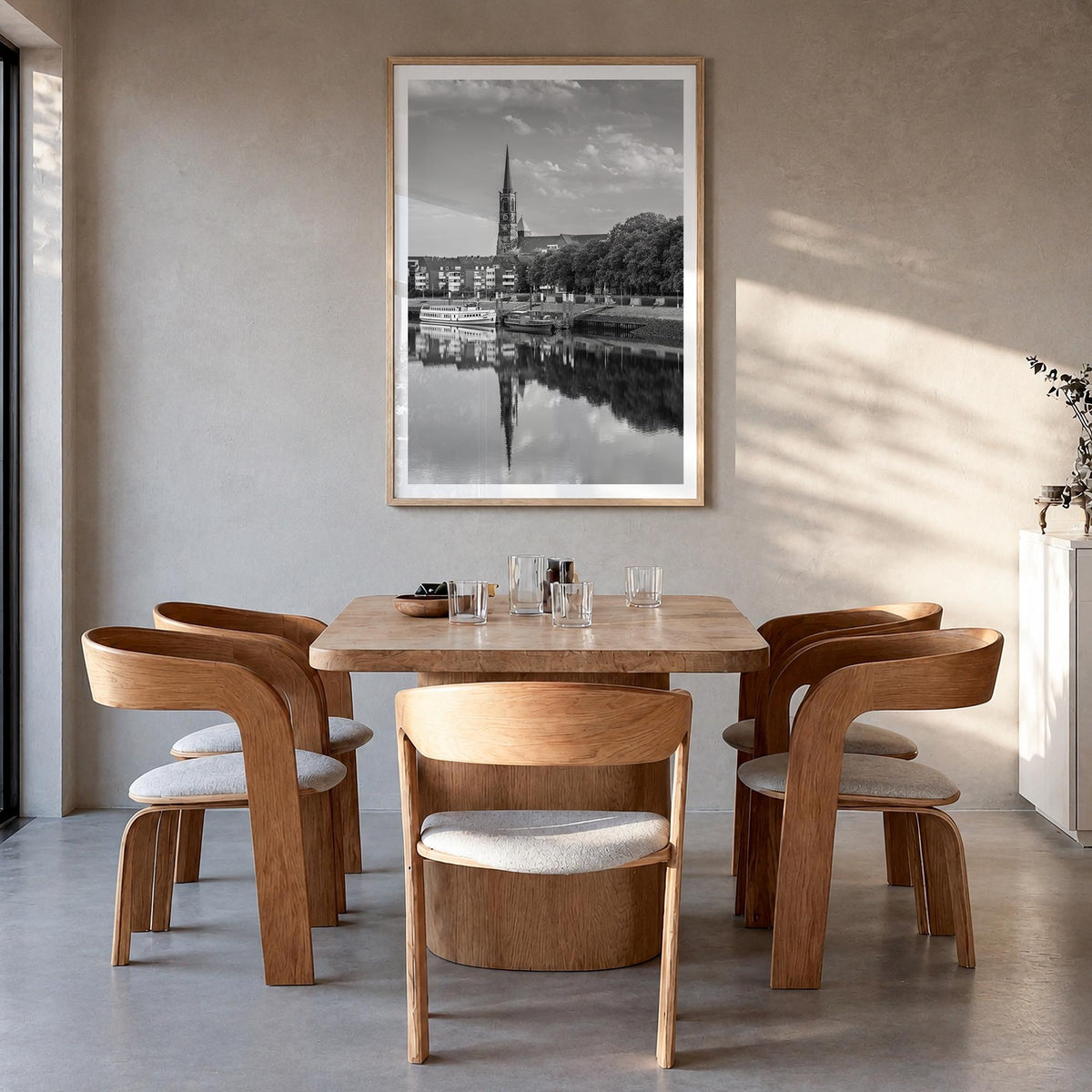 Bremen black & white photo poster of Germany – vertical wall art in natural wood frame with white border, hanging on wall