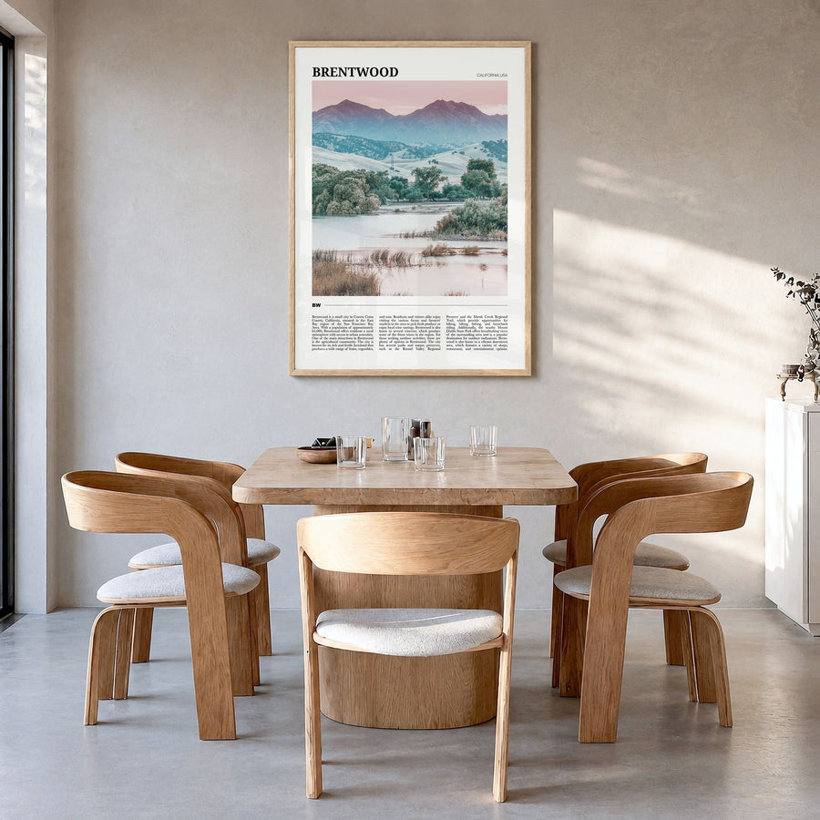 Brentwood Travel Poster in a natural wood frame, hanging in a dining room