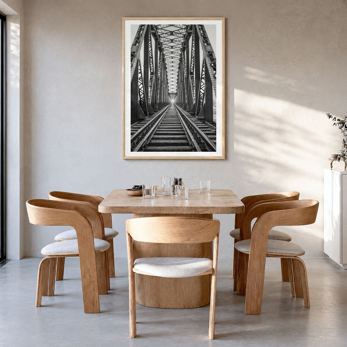 Bridge Photo Poster in a natural wood frame, hanging in a dining room, white border