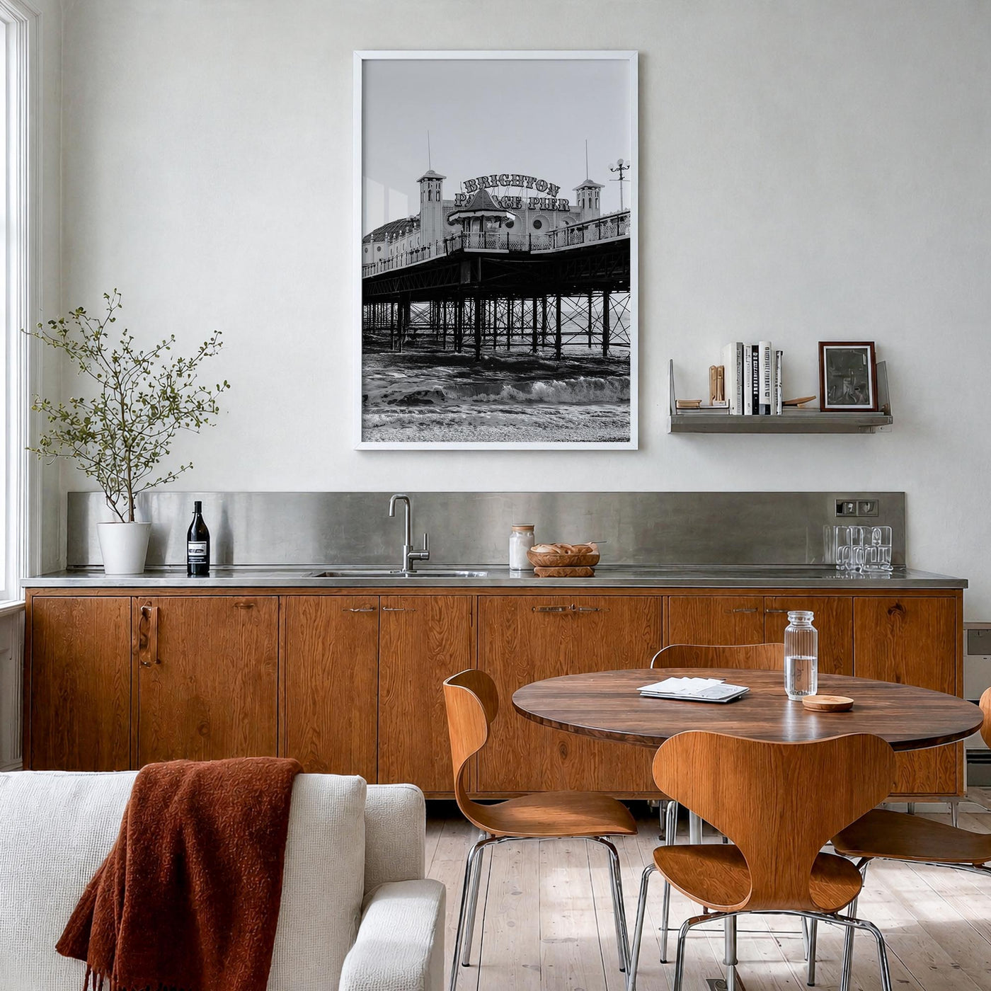 Brighton black & white photo poster of England, UK – vertical wall art in white wood frame, hanging on wall