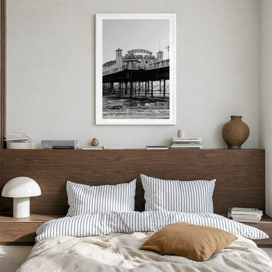 Brighton Photo Poster in a white wood frame, hanging in a bedroom, white border
