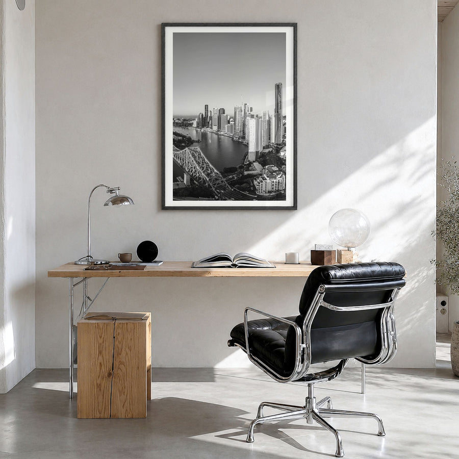 Brisbane Photo No 1 Poster in a black wood frame, hanging in a bright home office, white border