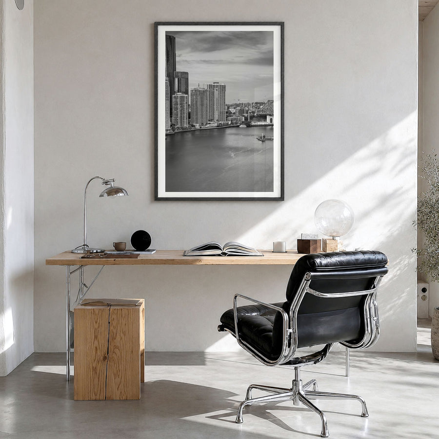 Brisbane Photo No 2 Poster in a black wood frame, hanging in a bright home office, white border