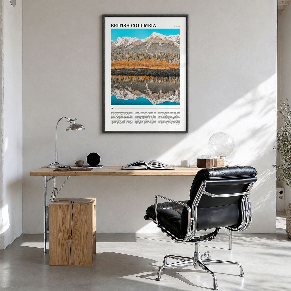 British Columbia Travel Poster in a black wood frame, hanging in a bright home office