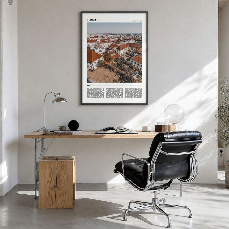 Brno Travel Poster in a black wood frame, hanging in a bright home office