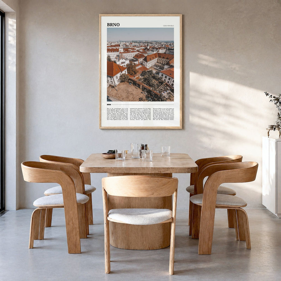 Brno Travel Poster in a natural wood frame, hanging in a dining room