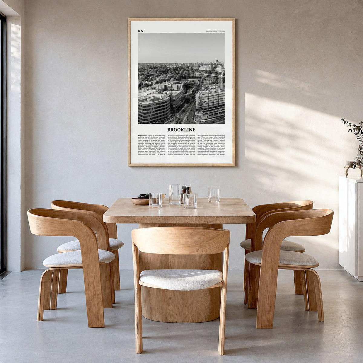 Brookline Newspaper Poster in a natural wood frame, hanging in a dining room