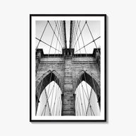 Brooklyn Bridge black & white photo poster of New York City, New York – vertical wall art, unframed print shown in interior m