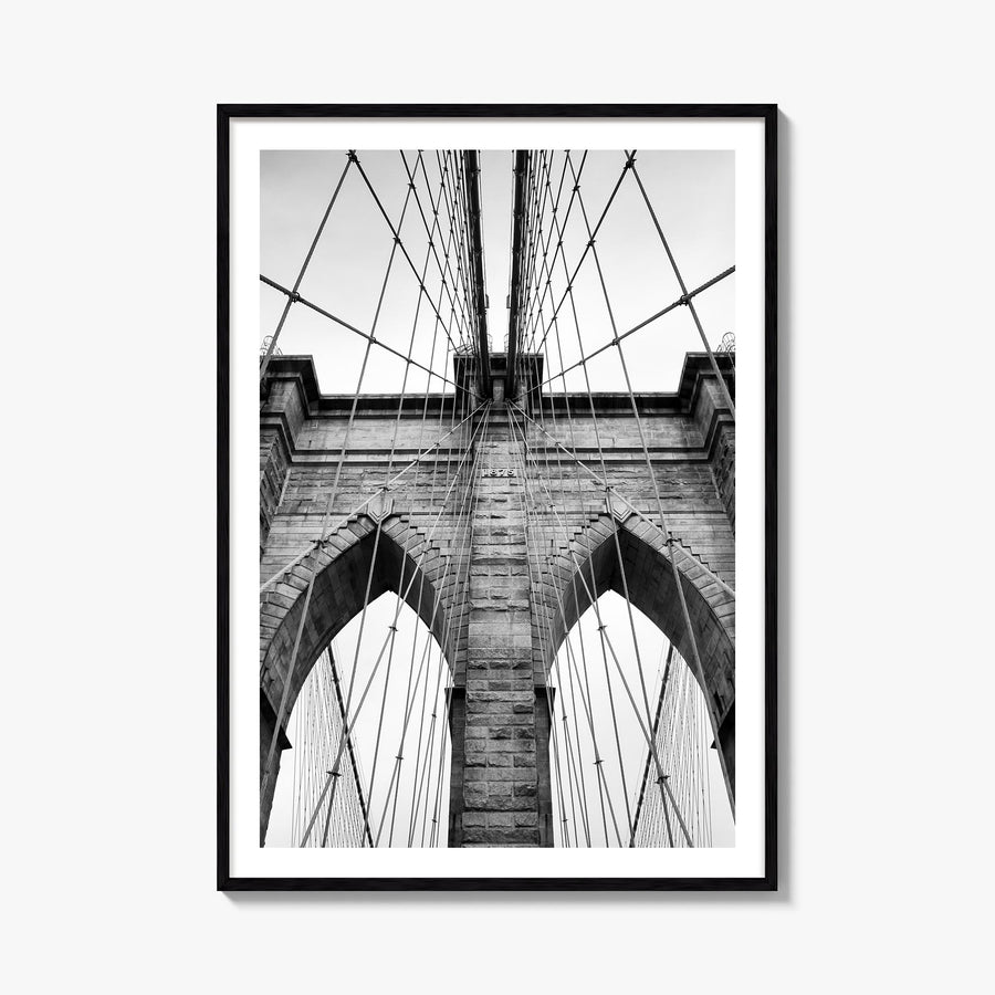 Brooklyn Bridge black & white photo poster of New York City, New York – vertical wall art, unframed print shown in interior m