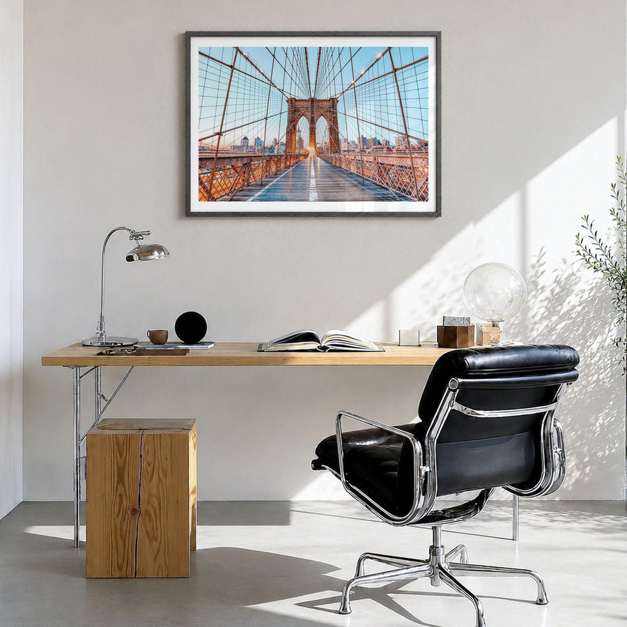 Brooklyn Photo Poster in a black wood frame, hanging in a bright home office, white border