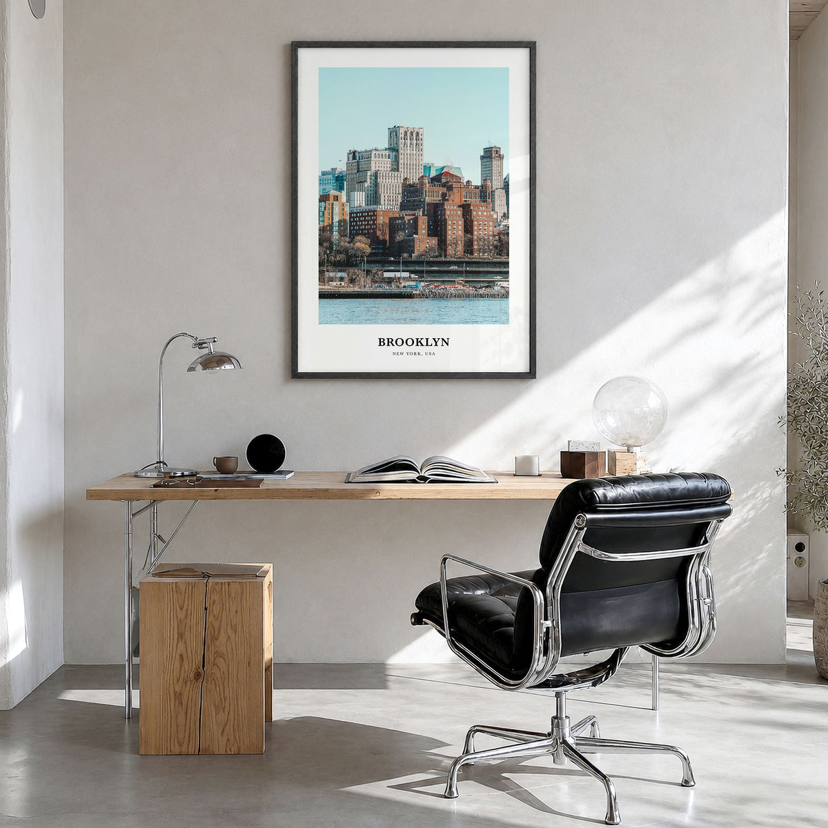 Brooklyn Classic No 1 Poster in a black wood frame, hanging in a bright home office