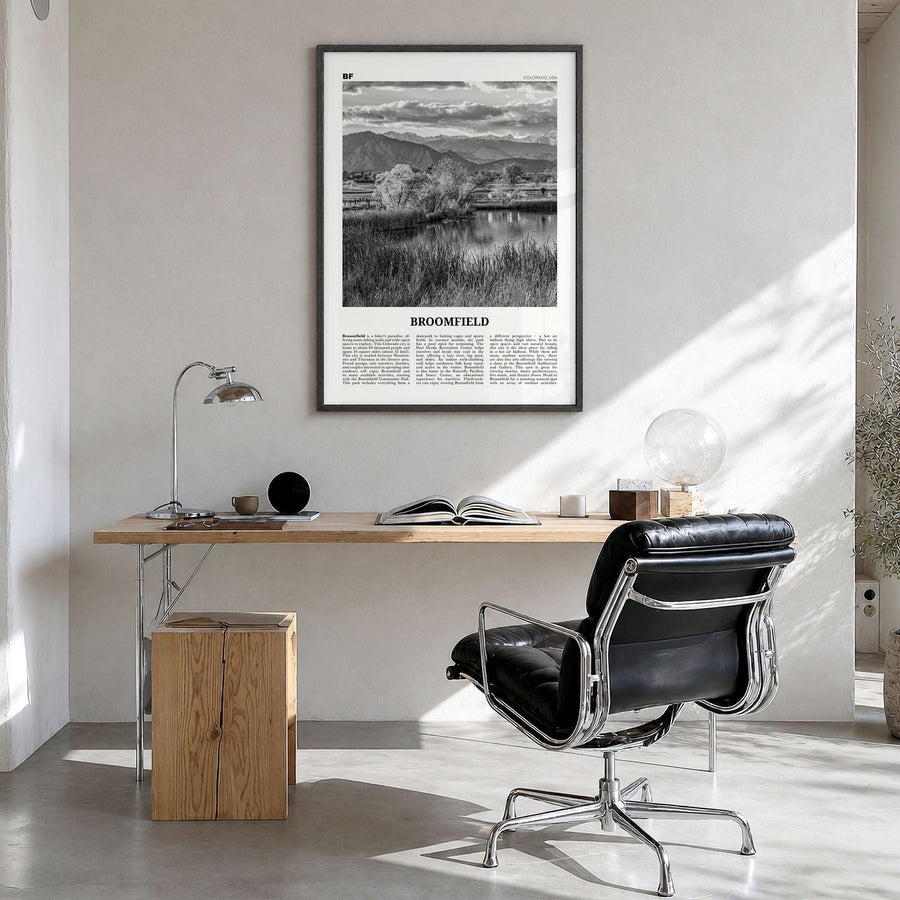 Broomfield Newspaper Poster in a black wood frame, hanging in a bright home office