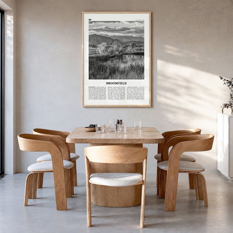 Broomfield Newspaper Poster in a natural wood frame, hanging in a dining room
