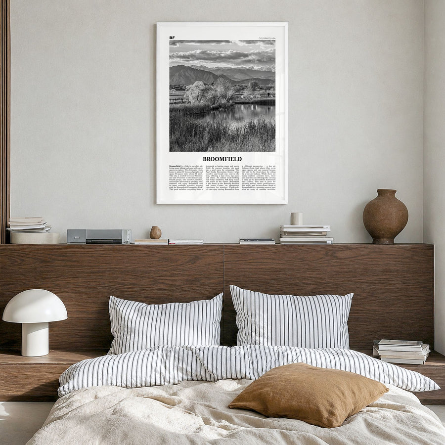 Broomfield Newspaper Poster in a white wood frame, hanging in a bedroom