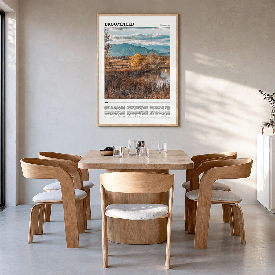 Broomfield Travel Poster in a natural wood frame, hanging in a dining room