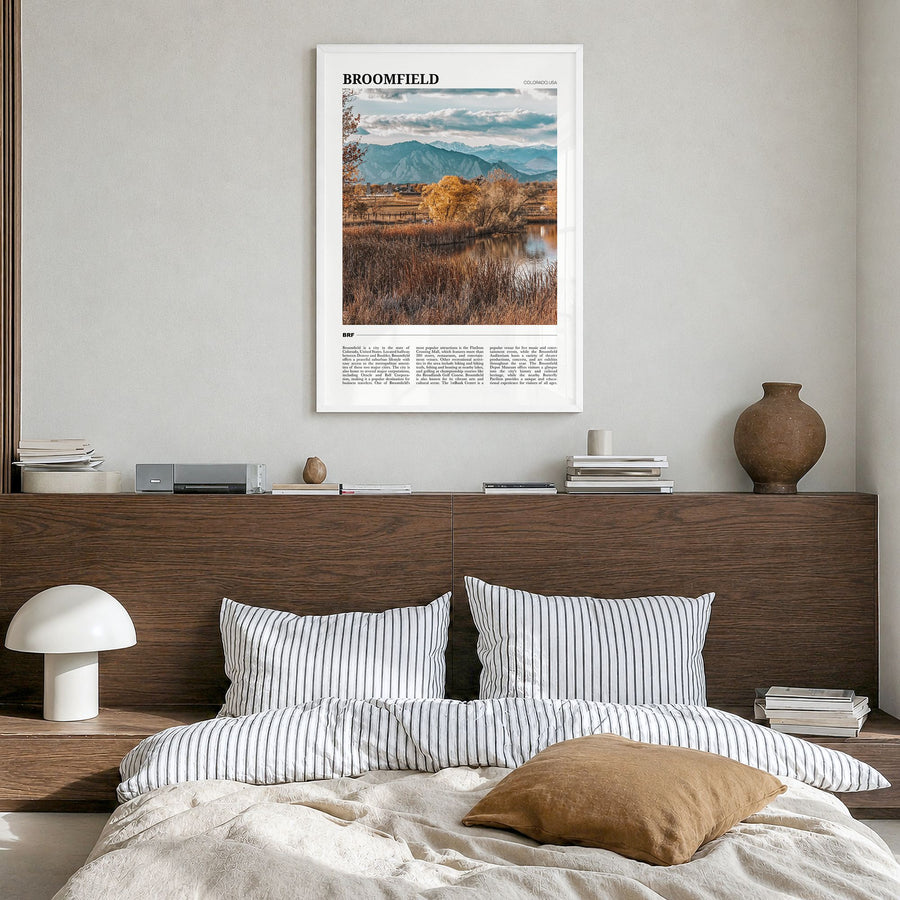 Broomfield Travel Poster in a white wood frame, hanging in a bedroom