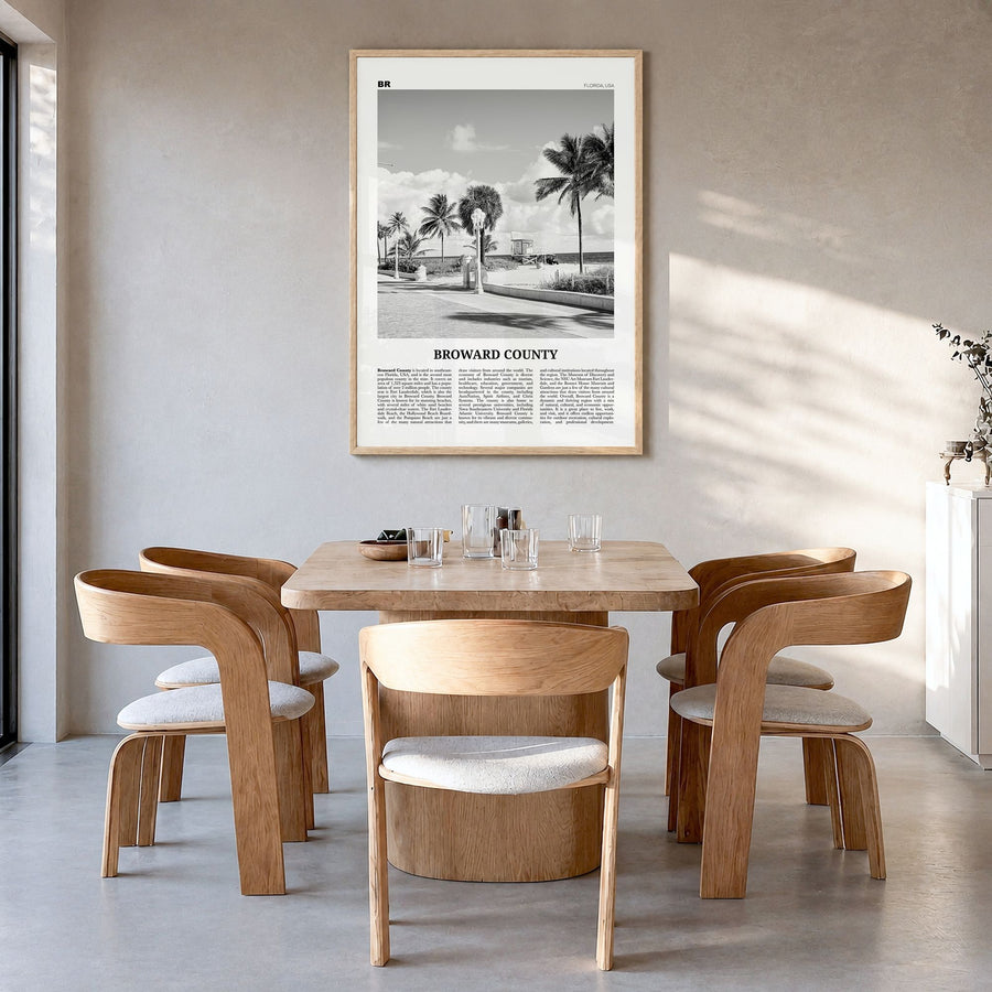 Broward County Newspaper Poster in a natural wood frame, hanging in a dining room