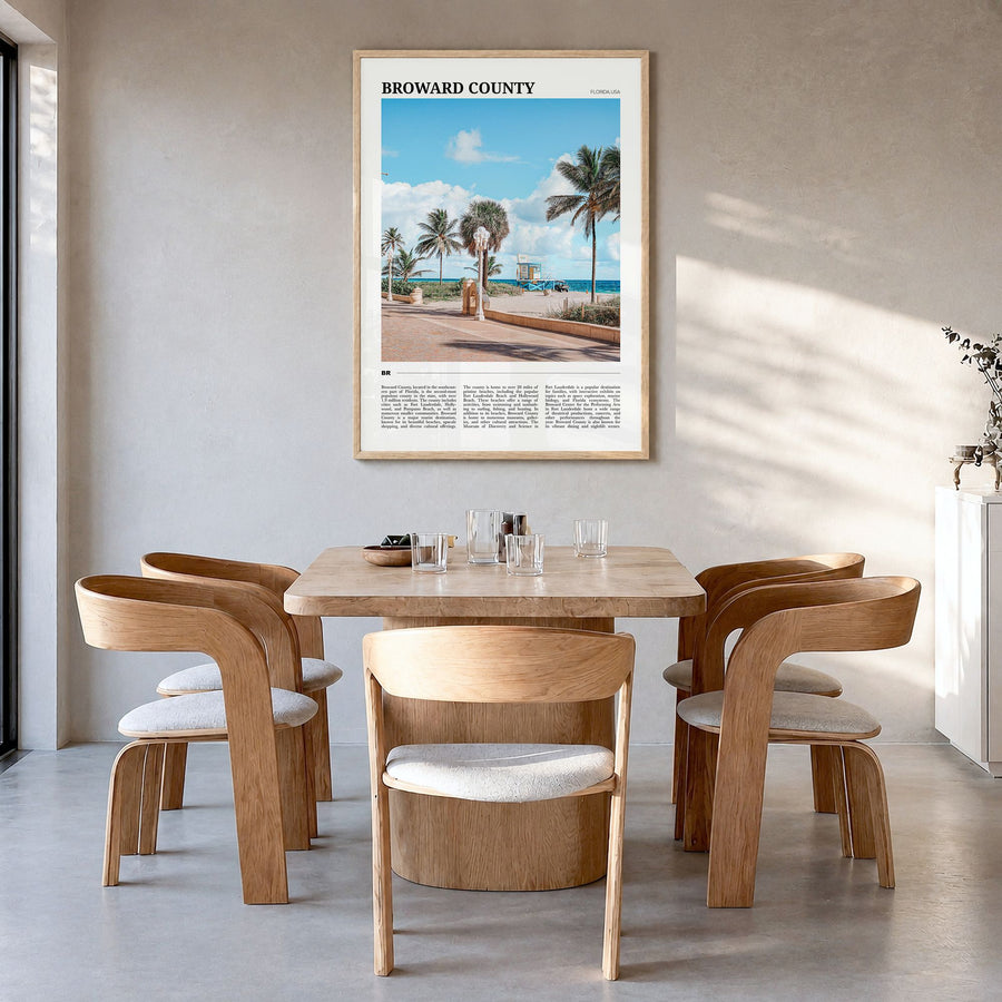 Broward County Travel Poster in a natural wood frame, hanging in a dining room