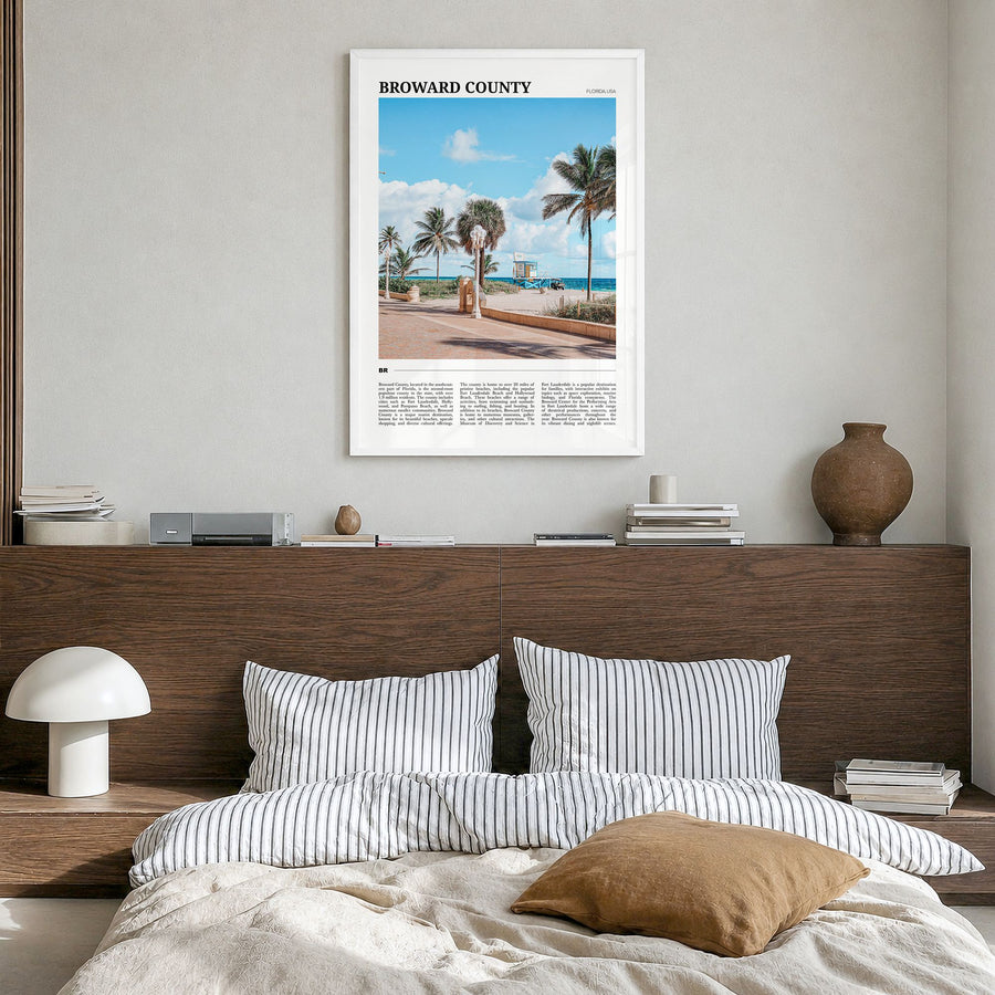 Broward County Travel Poster in a white wood frame, hanging in a bedroom