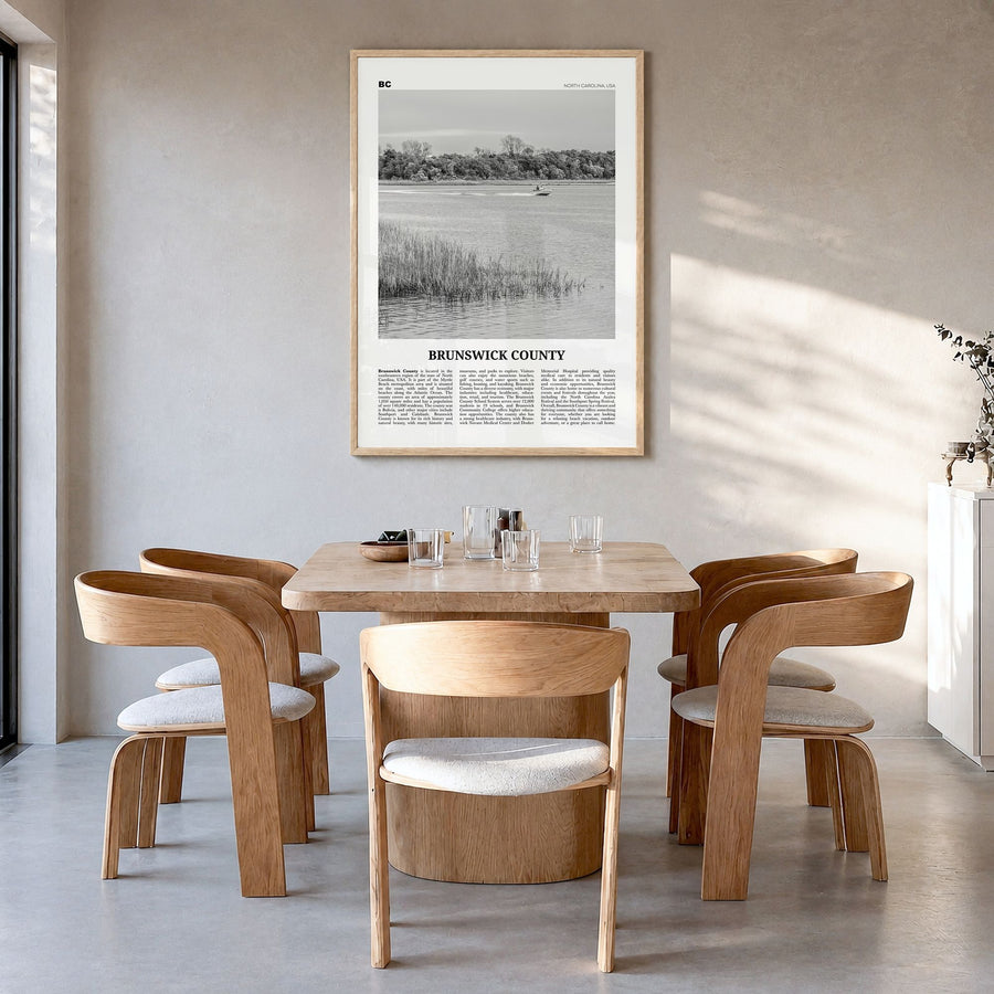 Brunswick County Newspaper Poster in a natural wood frame, hanging in a dining room