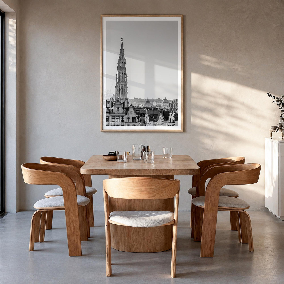 Brussels black & white photo poster of Belgium – vertical wall art in natural wood frame with white border, hanging on wall