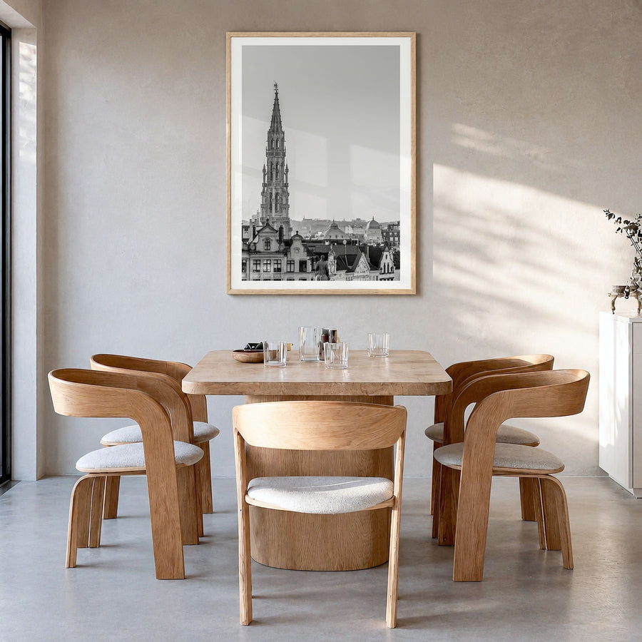 Brussels Photo Poster in a natural wood frame, hanging in a dining room, white border