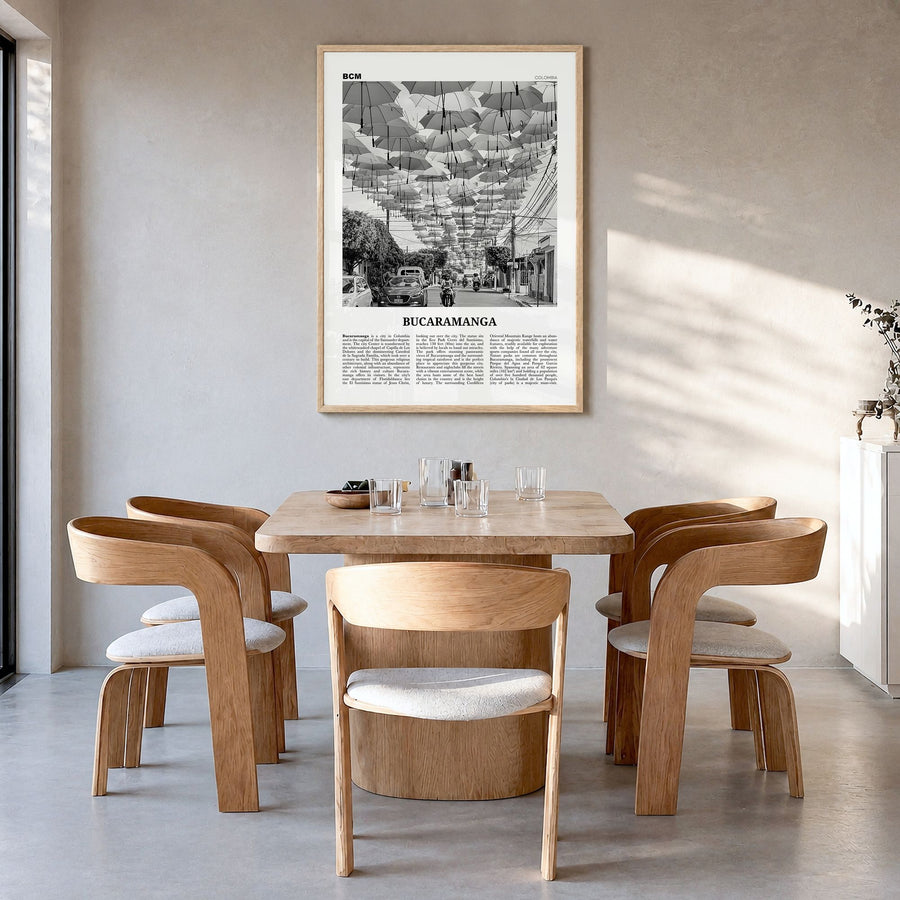 Bucaramanga Newspaper Poster in a natural wood frame, hanging in a dining room