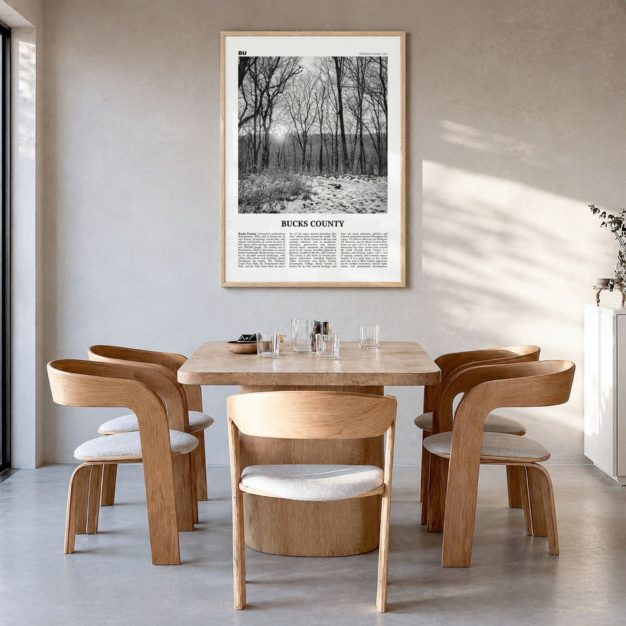 Bucks County Newspaper Poster in a natural wood frame, hanging in a dining room
