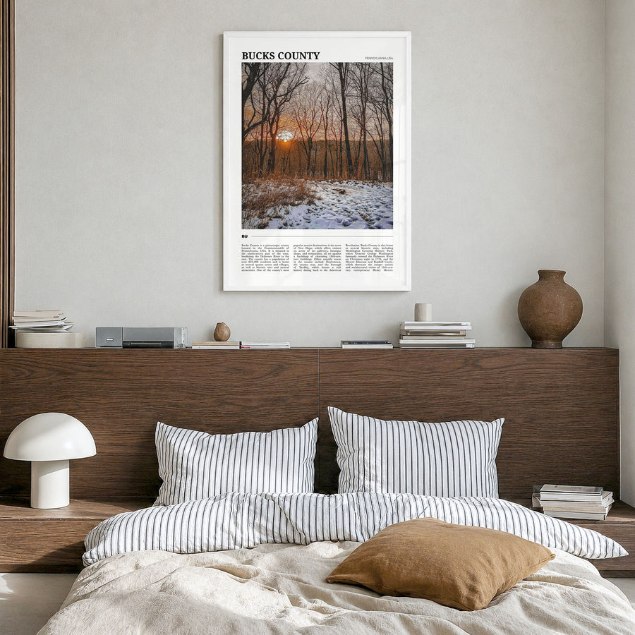 Bucks County Travel Poster in a white wood frame, hanging in a bedroom