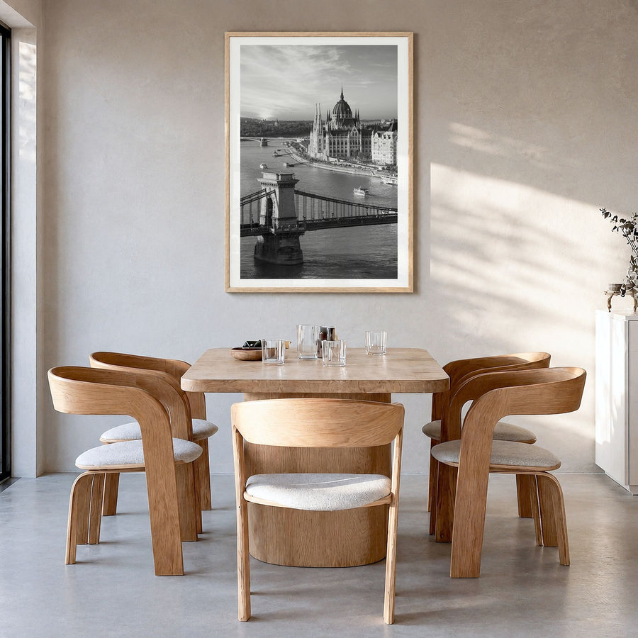 Budapest Photo Poster in a natural wood frame, hanging in a dining room, white border