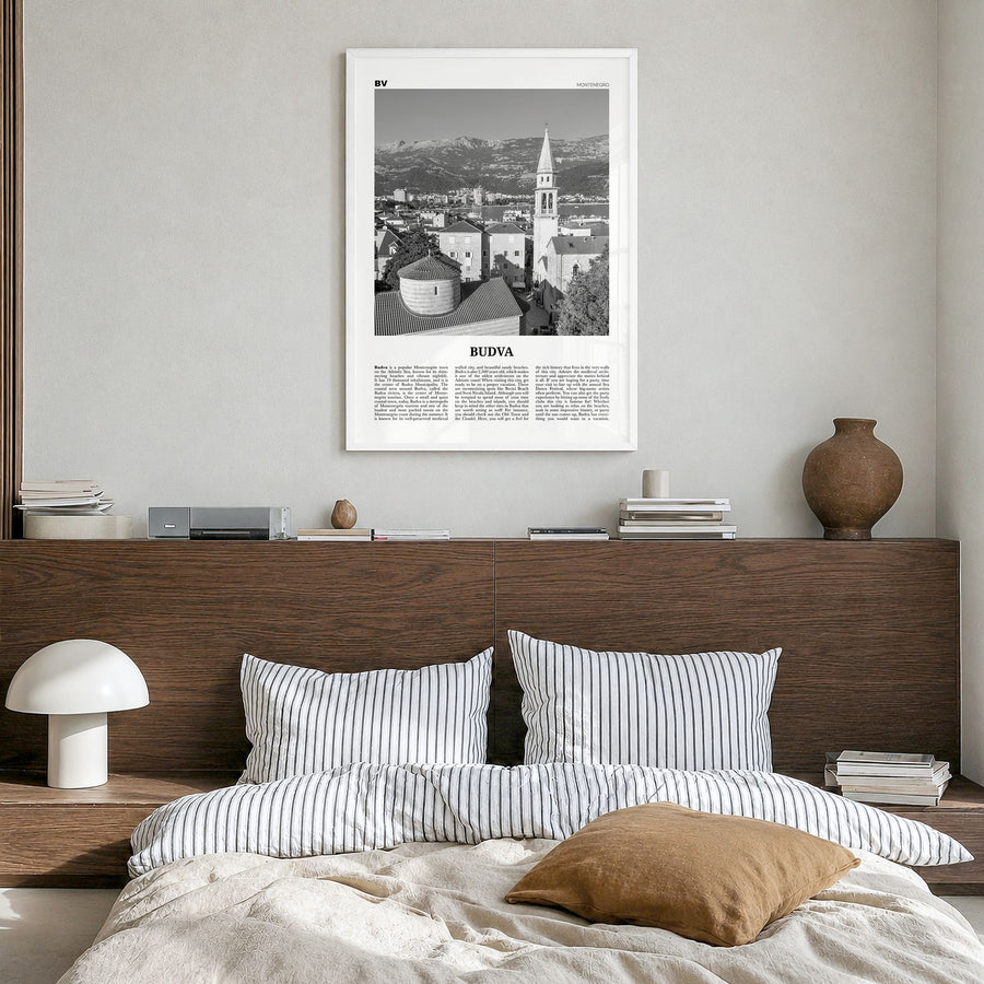 Budva Newspaper Poster in a white wood frame, hanging in a bedroom
