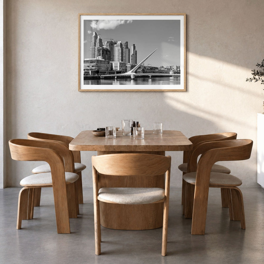 Buenos Aires Photo Poster in a natural wood frame, hanging in a dining room, white border