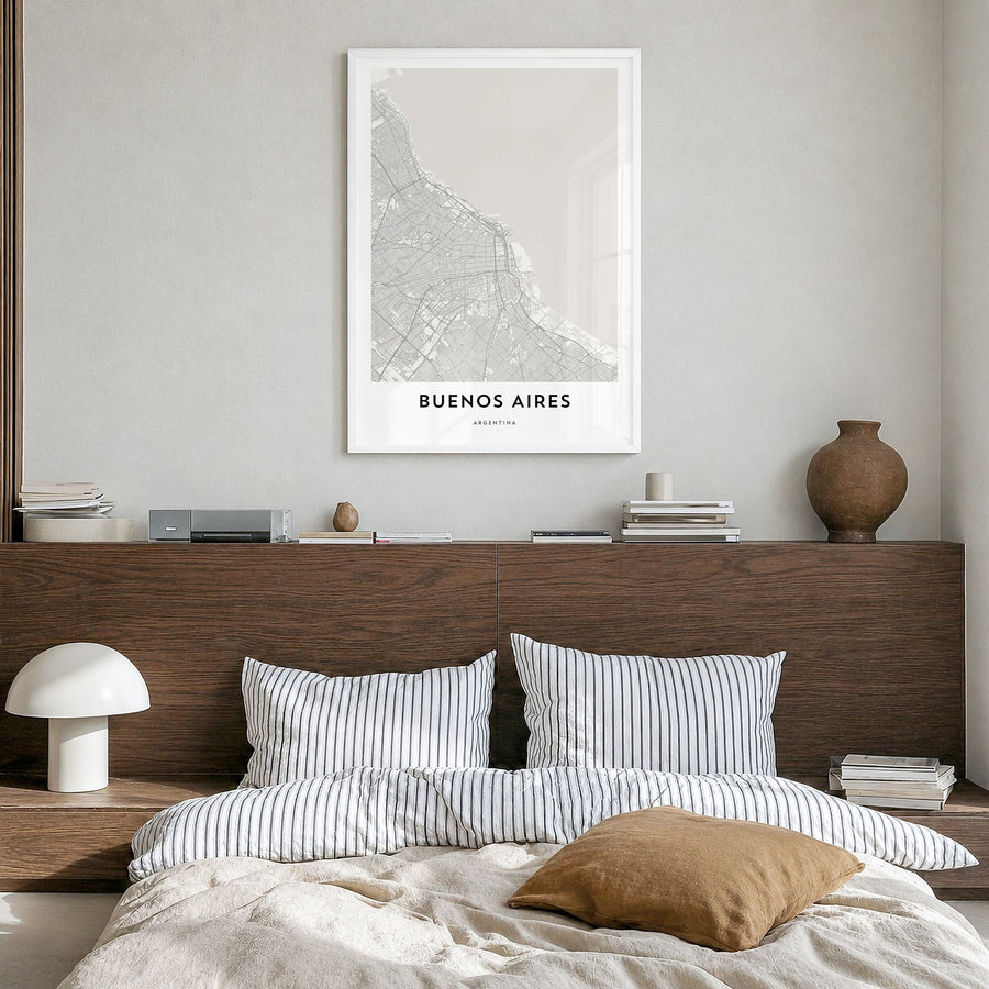 Buenos Aires Map Poster in a white wood frame, hanging in a bedroom