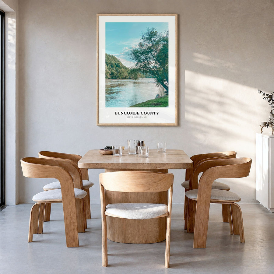 Buncombe County Classic Poster in a natural wood frame, hanging in a dining room