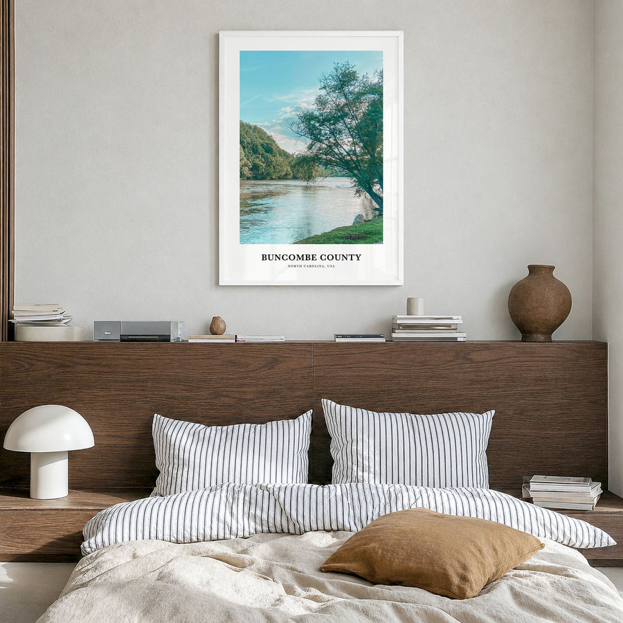 Buncombe County Classic Poster in a white wood frame, hanging in a bedroom