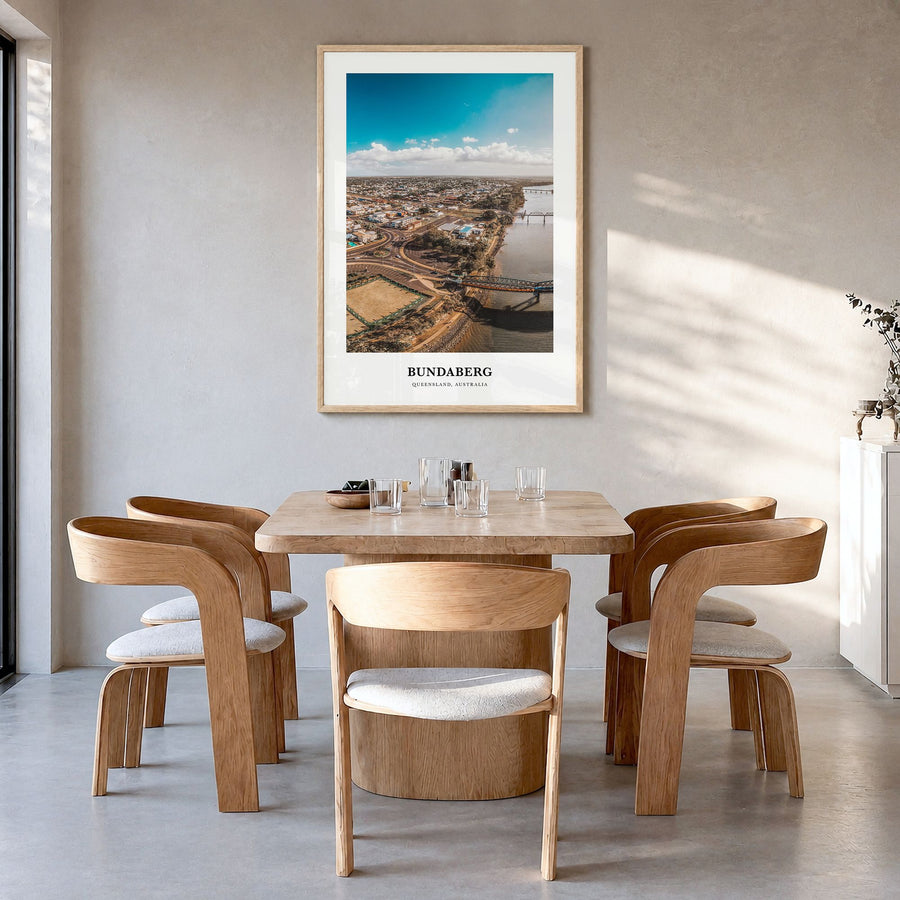 Bundaberg Classic No 1 Poster in a natural wood frame, hanging in a dining room