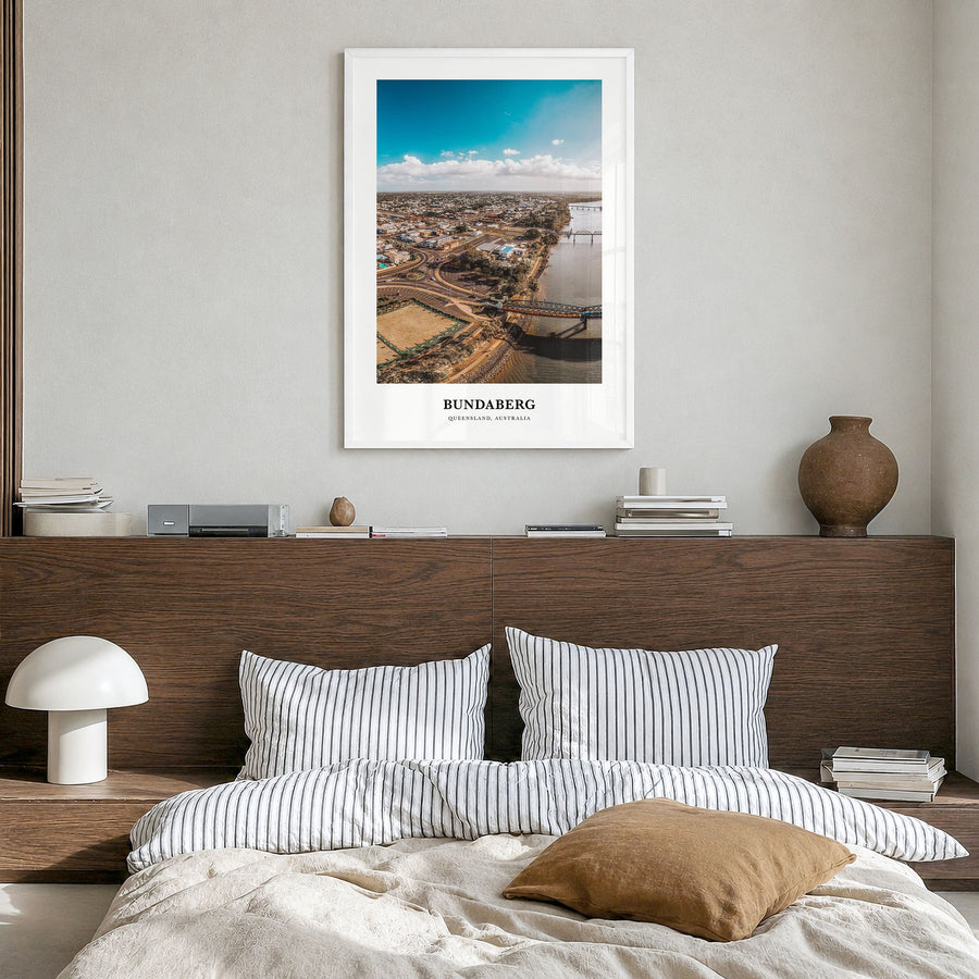 Bundaberg Classic No 1 Poster in a white wood frame, hanging in a bedroom