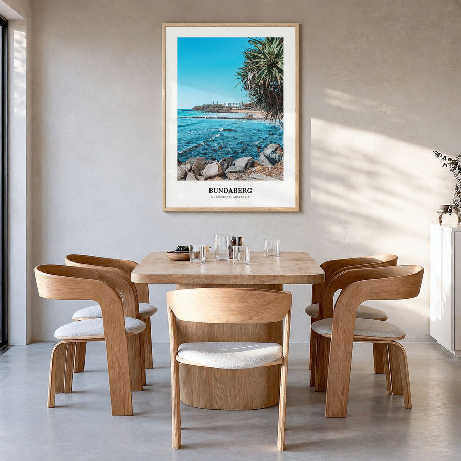 Bundaberg Classic No 2 Poster in a natural wood frame, hanging in a dining room