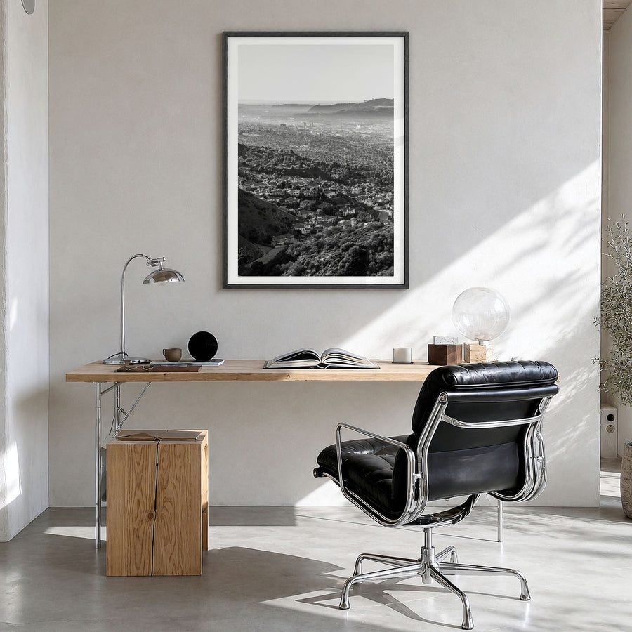 Burbank Photo Poster in a black wood frame, hanging in a bright home office, white border