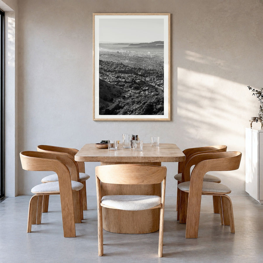 Burbank Photo Poster in a natural wood frame, hanging in a dining room, white border