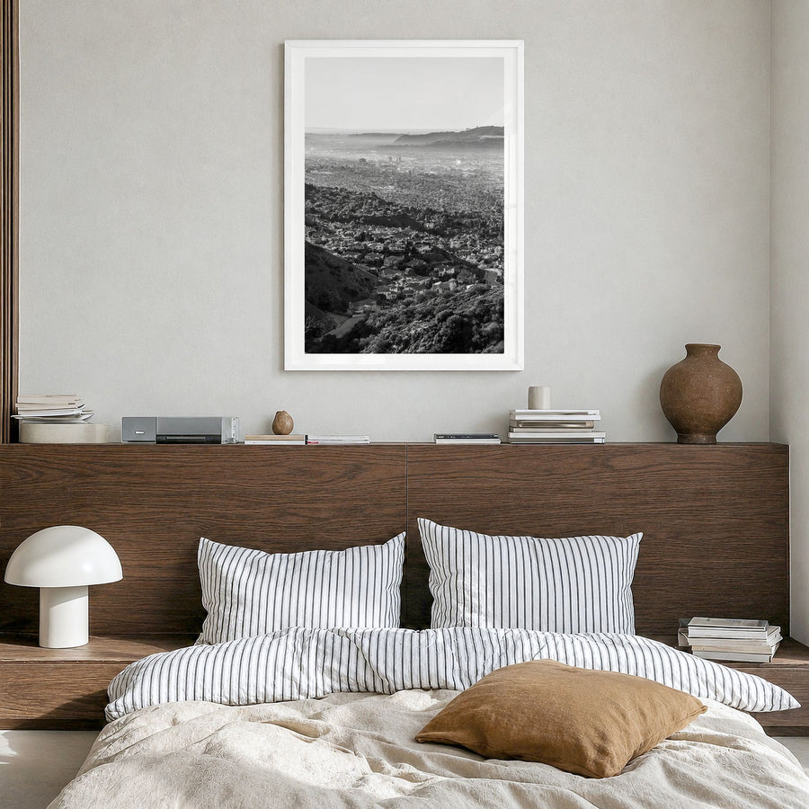 Burbank Photo Poster in a white wood frame, hanging in a bedroom, white border