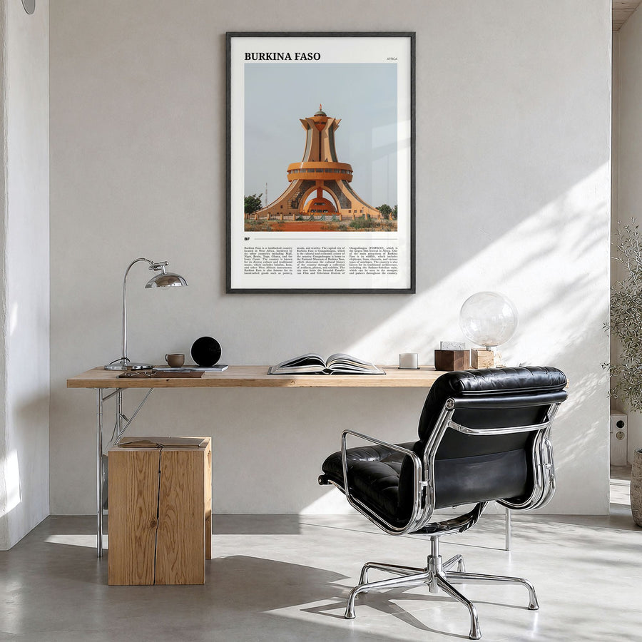 Burkina Faso Travel Poster in a black wood frame, hanging in a bright home office