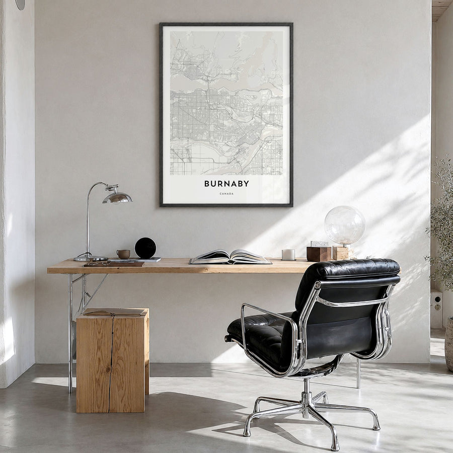 Burnaby Map Poster in a black wood frame, hanging in a bright home office