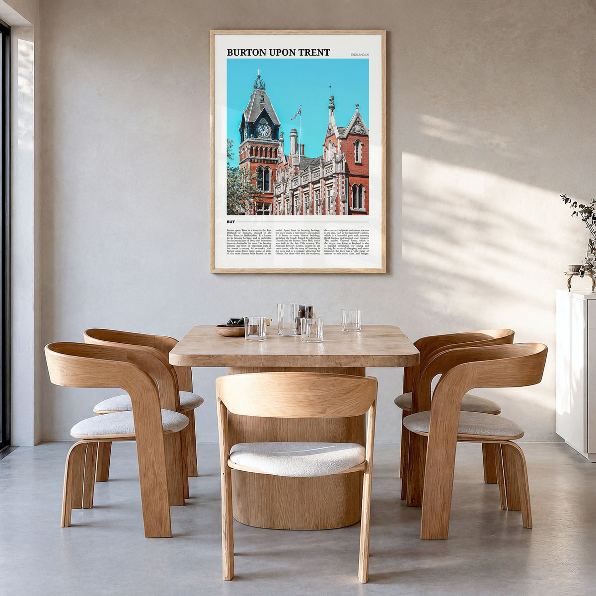 Burton upon Trent Travel Poster in a natural wood frame, hanging in a dining room