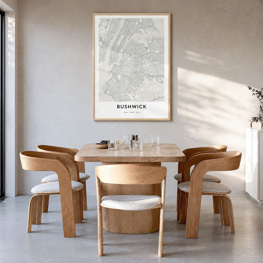 Bushwick Map Poster in a natural wood frame, hanging in a dining room
