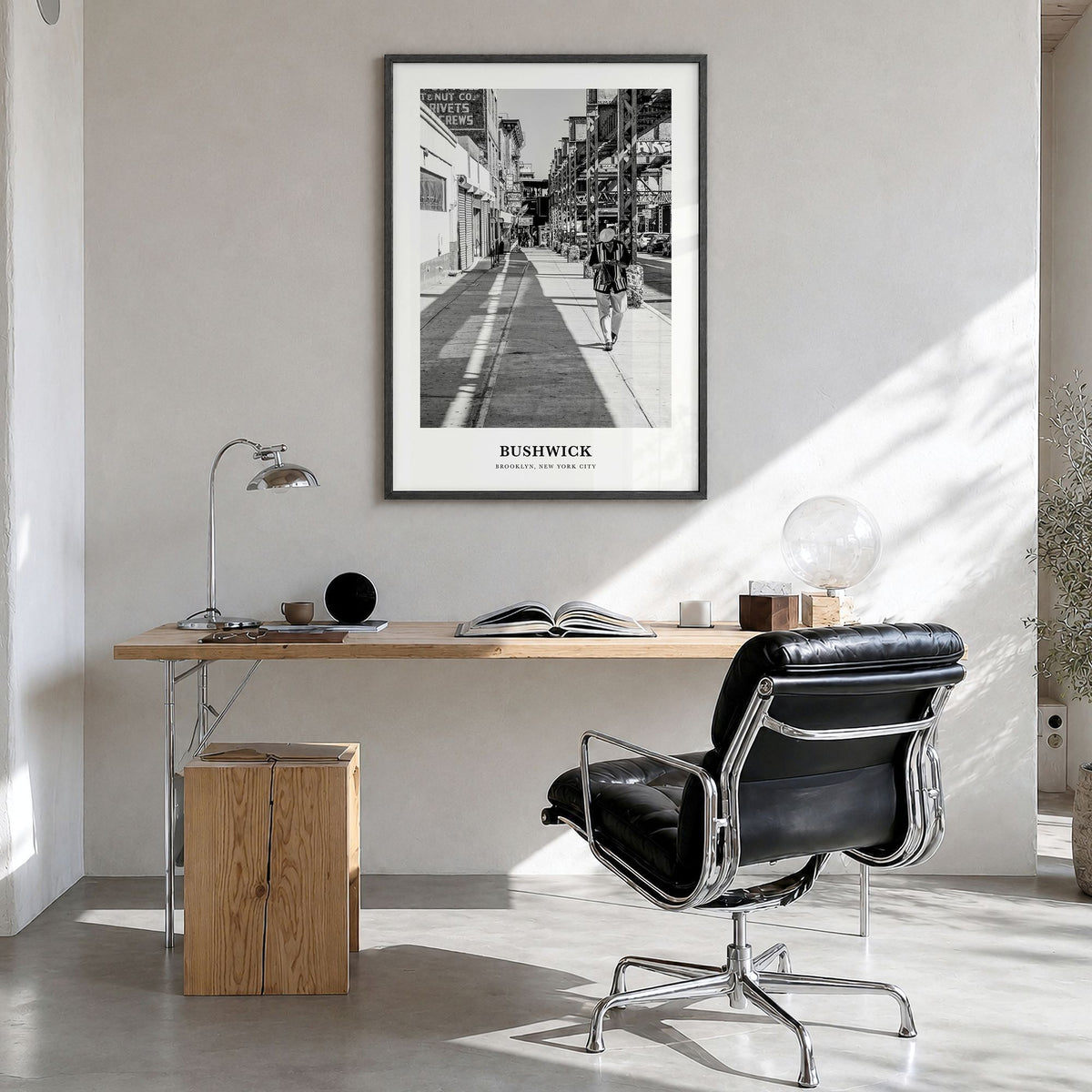 Bushwick Classic Poster in a black wood frame, hanging in a bright home office