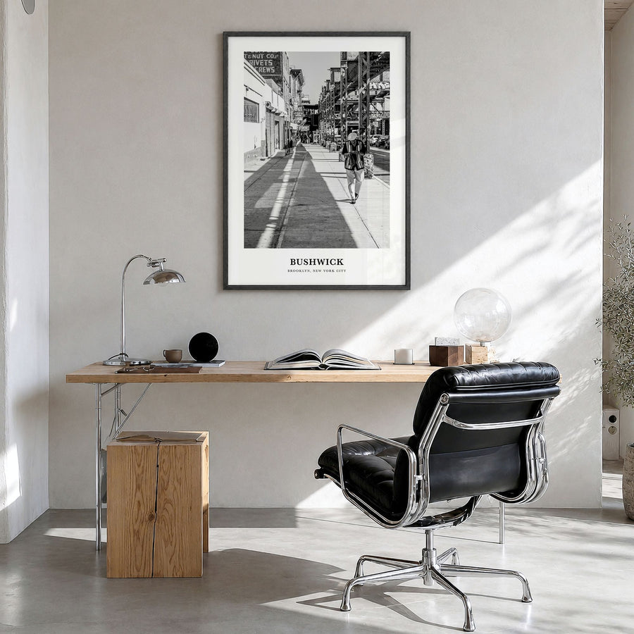 Bushwick Classic Poster in a black wood frame, hanging in a bright home office