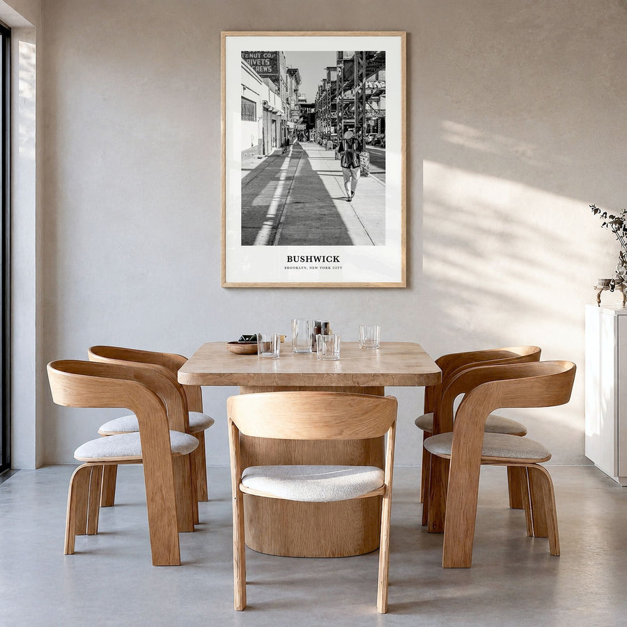 Bushwick Classic Poster in a natural wood frame, hanging in a dining room