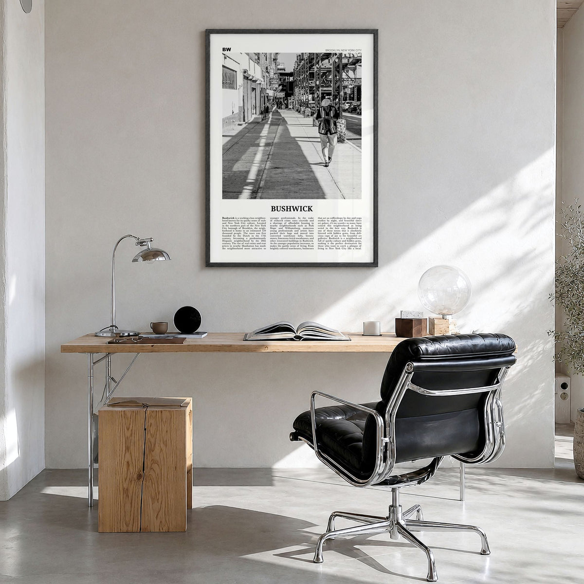 Bushwick Newspaper Poster in a black wood frame, hanging in a bright home office