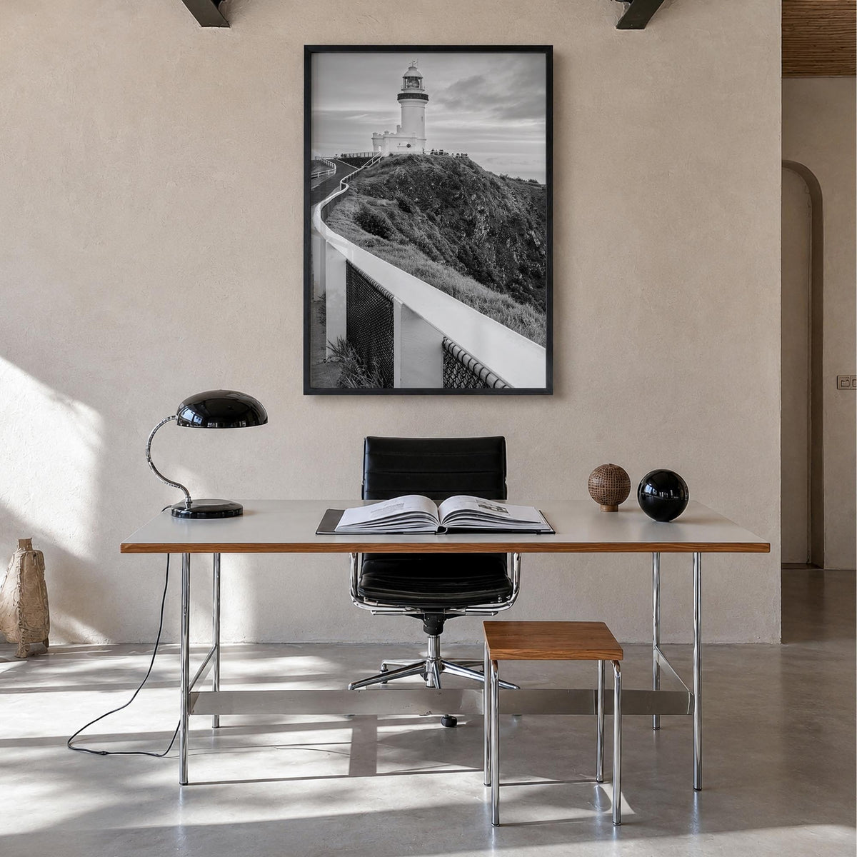 Byron Bay black & white photo poster of New South Wales, Australia – vertical wall art in black wood frame, hanging on wall